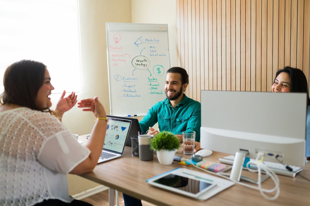Diverse marketing team collaborating on business growth strategy